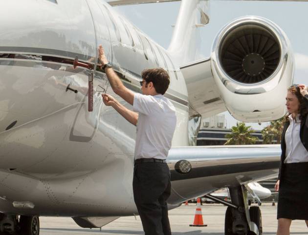 male-and-female-pilots-reading-flight-plan-in-cabi-2024-10-21-17-06-38-utc