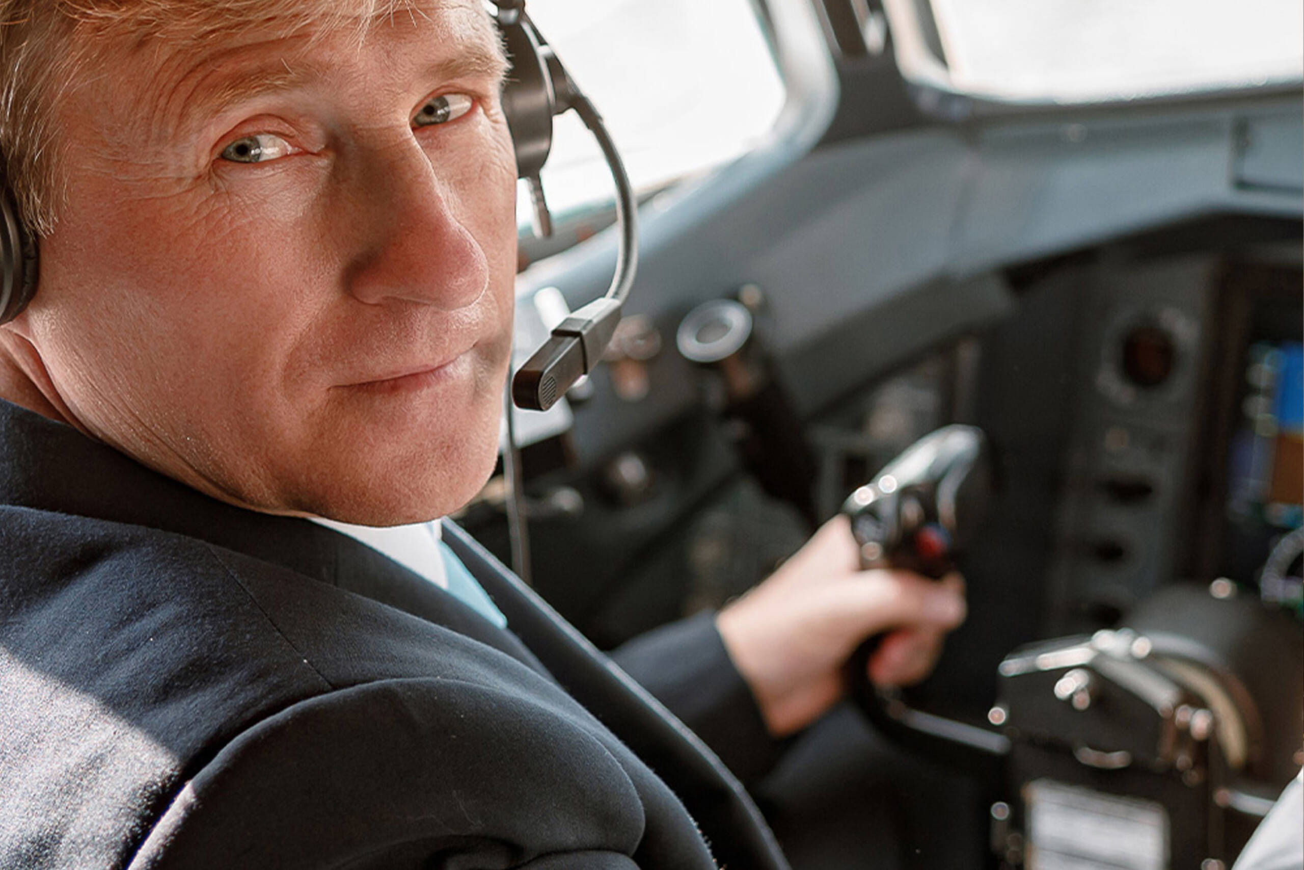 male-and-female-pilots-reading-flight-plan-in-cabi-2024-10-21-17-06-38-utc